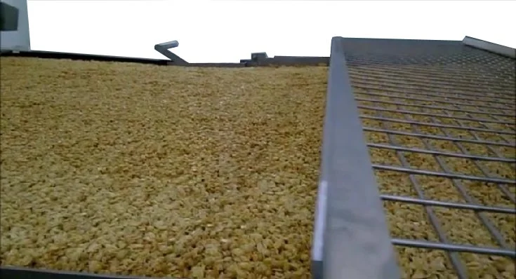 Feeder/spreader for granola product forming
