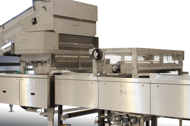 Feeder/spreader for granola product forming